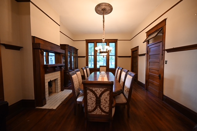 a dining room with a table and chairs
