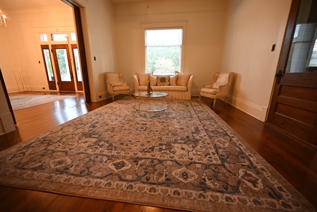 a room with a rug and a couch