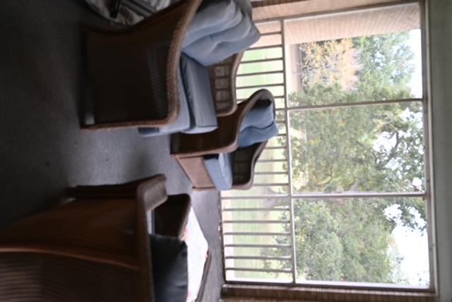 a group of chairs on a porch