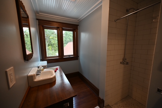 a bathroom with a sink and shower
