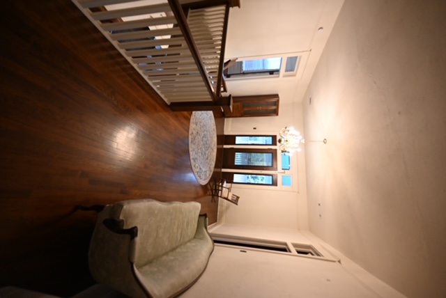 a room with a couch and a rug