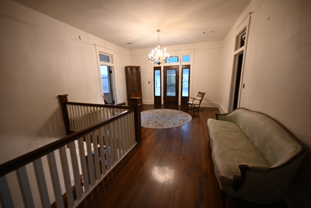 a room with a couch and a staircase