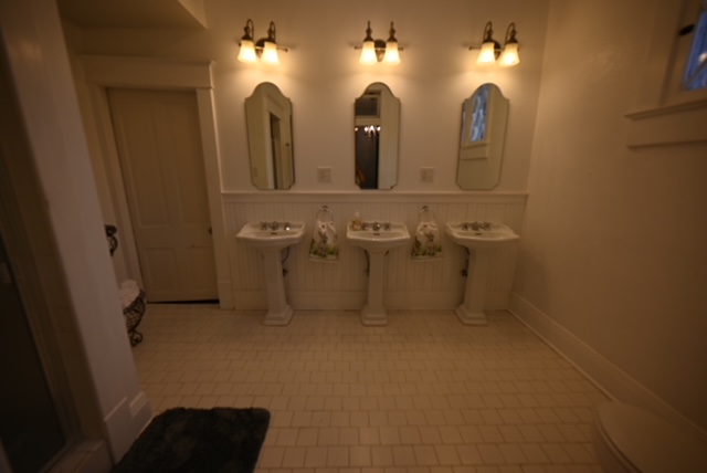 a bathroom with sinks and mirrors