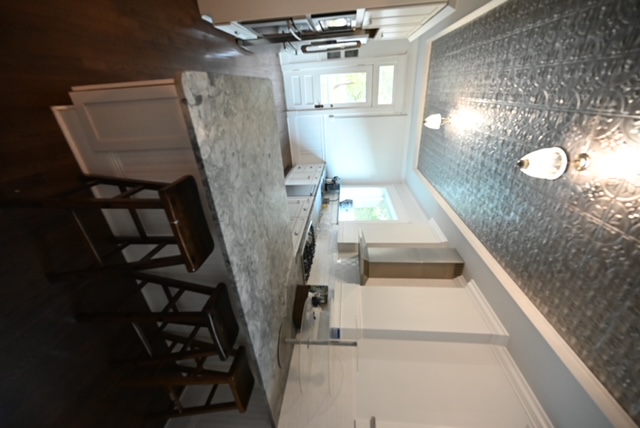 a kitchen with a marble counter top